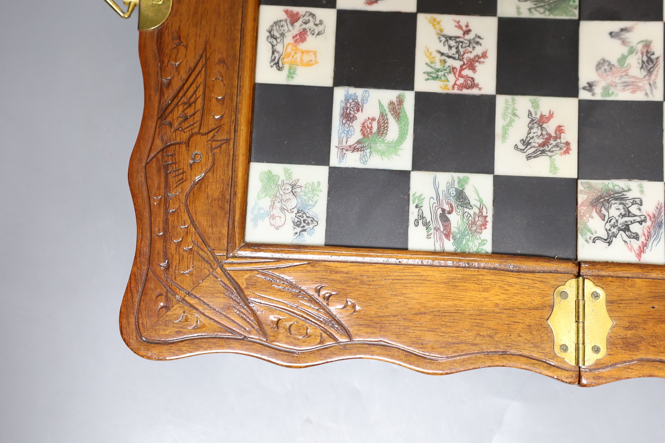 A Chinese chess set with resin pieces, 39x39cm